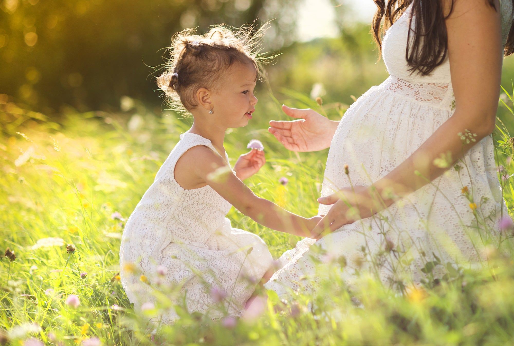Pregnant woman with child nature